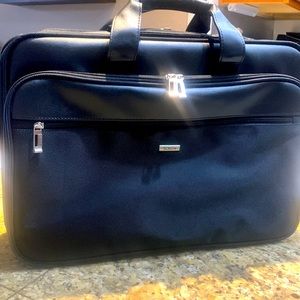 Briefcase with Laptop holder section.